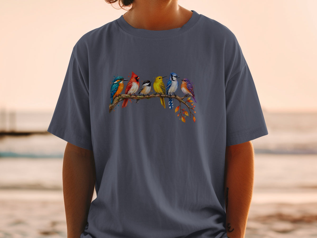 Six colorful birds perched on a branch with autumn leaves on a dark grey t-shirt.