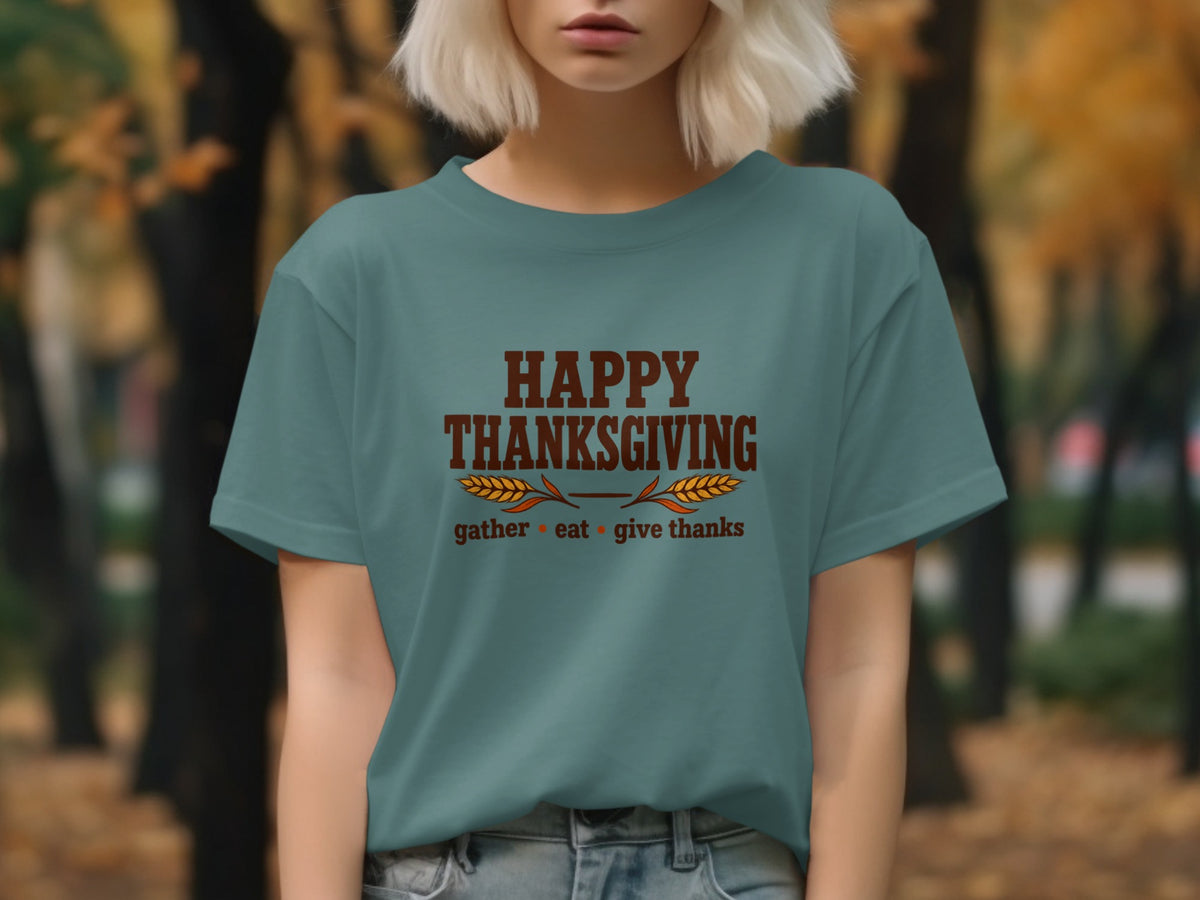 Teal t-shirt with "Happy Thanksgiving gather eat give thanks" text and wheat graphic.