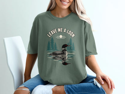 Green t-shirt with "Leave Me a Loon" text and a loon on water graphic.