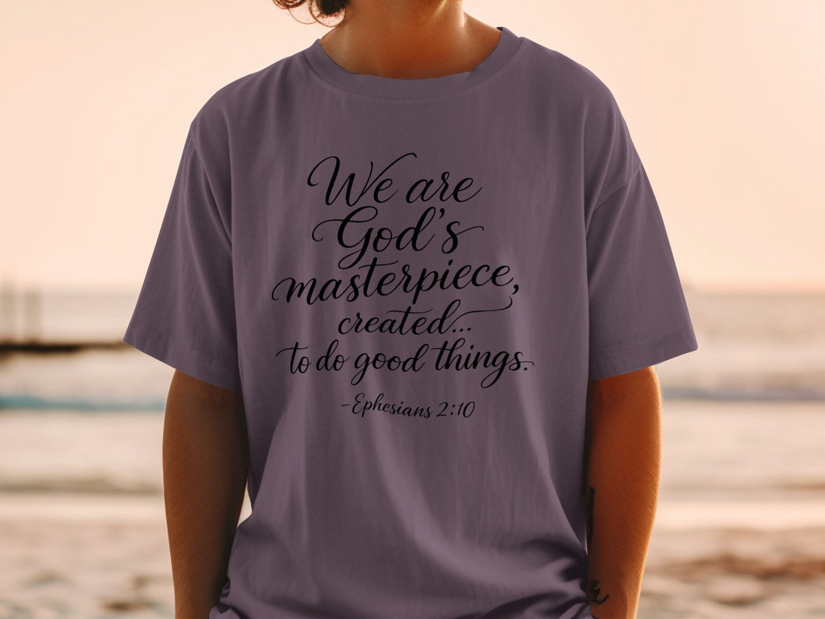 T-shirt with black text: "We are God's masterpiece, created... to do good things. -Ephesians 2:10"