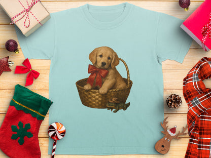 Light blue t-shirt with a golden retriever puppy in a basket wearing a bow.