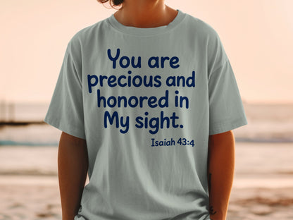 Light grey t-shirt with blue text "You are precious and honored in My sight. Isaiah 43:4".