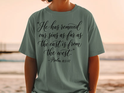 T-shirt with "He has removed our sins as far as the east is from the west. -Psalm 103:12"