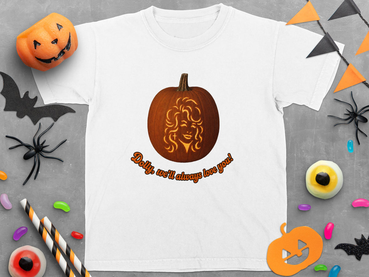 White t-shirt with carved pumpkin graphic and "Dolly, we'll always love you!" text.