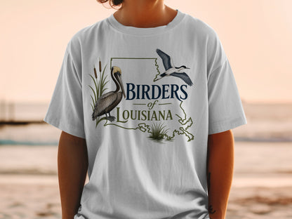 T-shirt with a graphic of a pelican, flying bird, and Louisiana outline text "Birders of Louisiana".