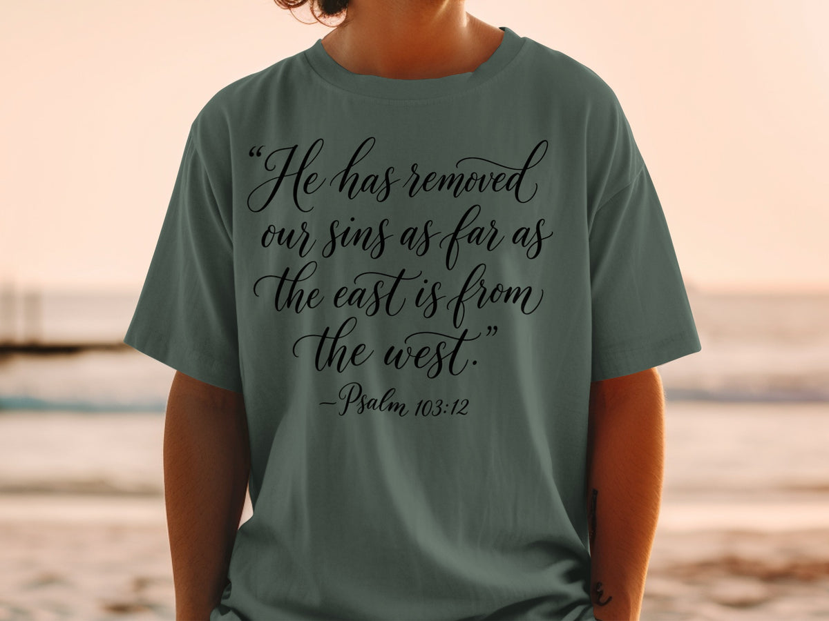 T-shirt with text "He has removed our sins as far as the east is from the west."
