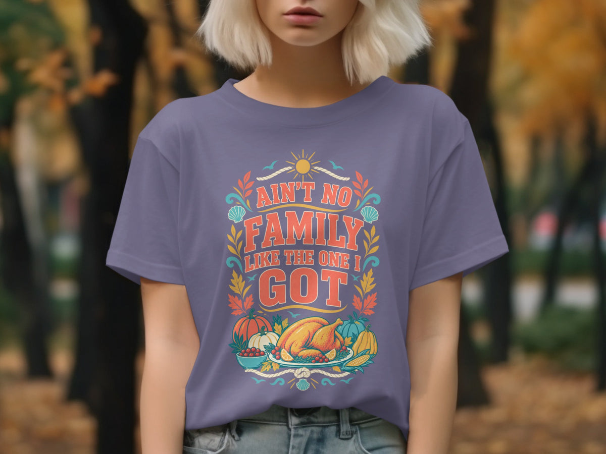 Purple t-shirt with "Ain't No Family Like The One I Got" text and Thanksgiving food graphic.