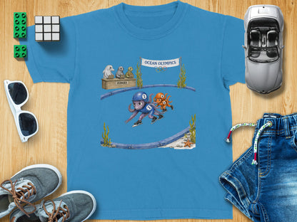 Blue t-shirt with cartoon octopus figure skaters at the Ocean Olympics.