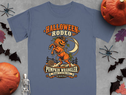 Halloween Rodeo Pumpkin Wrangler graphic on a blue t-shirt.