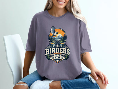 Graphic tee with binoculars, bird, and landscape; text "Birders Ready When It Starts".