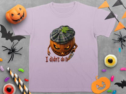 Purple t-shirt with a grinning pumpkin wearing a plaid hat holding a knife, text "I didn't do it".