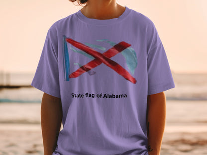 Lavender t-shirt with a watercolor-style Alabama flag design and text.
