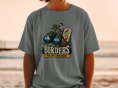 "Birders - You Got Me Here" text on a gray t-shirt with binoculars and birds graphic.