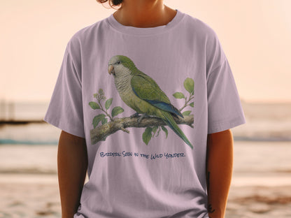 T-shirt with illustration of a green parrot on a branch and text "BIRDDERS: SEEN IN THE WILD YONDER".