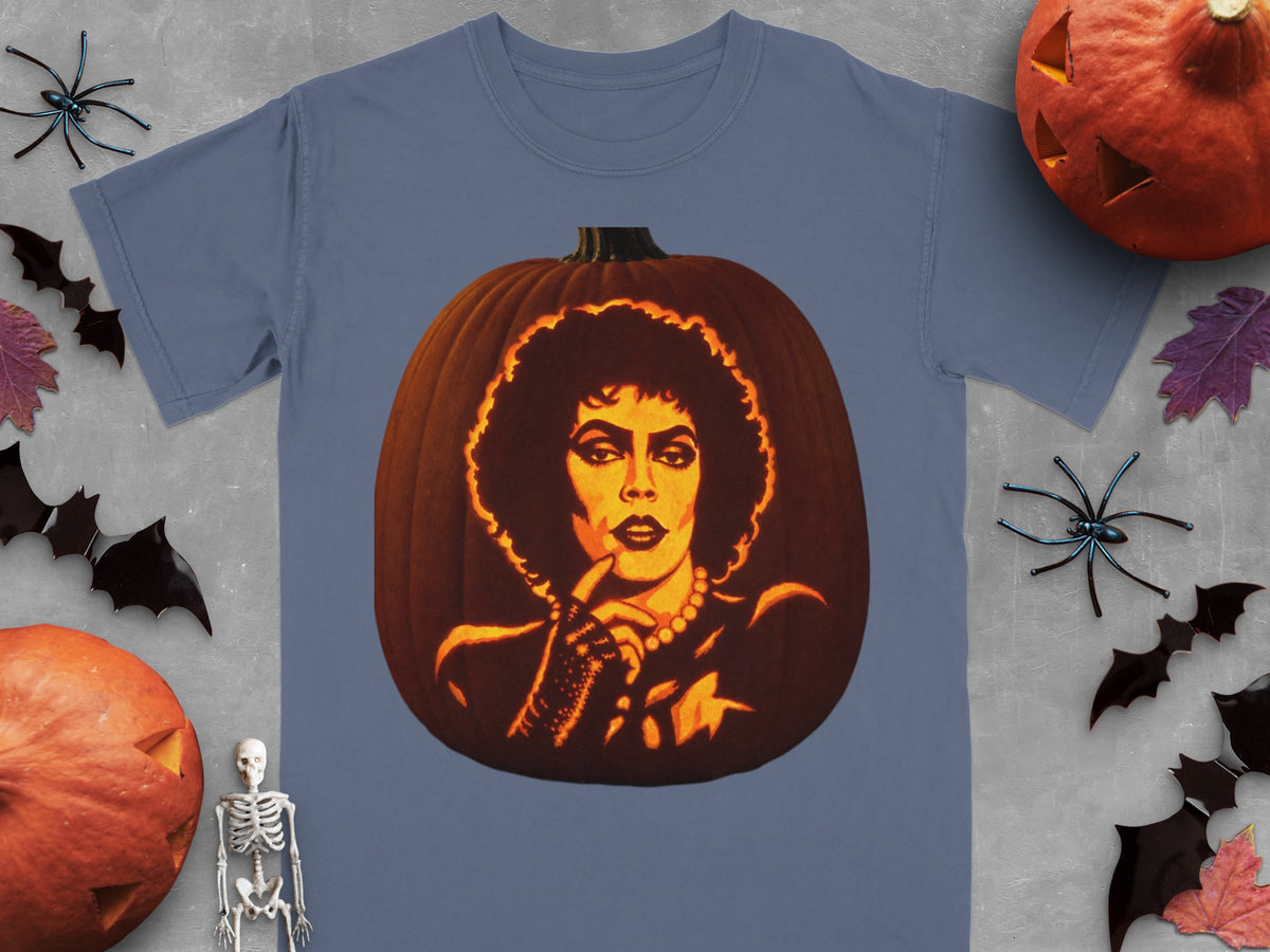 A blue t-shirt printed with a carved pumpkin design resembling Frank-N-Furter from The Rocky Horror Picture Show.