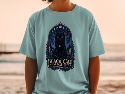 Black cat illustration with celestial elements and text "Black Cat Star Map Eyes Map to Halloween City".