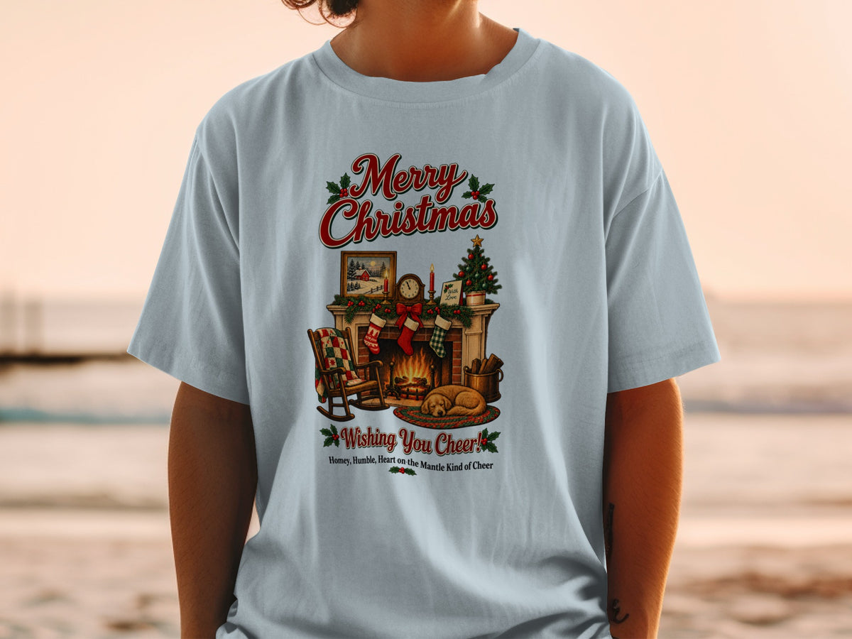 A light blue t-shirt featuring a Christmas fireplace illustration and the text Merry Christmas Wishing You Cheer!