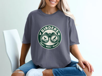 "Birders" graphic t-shirt with binoculars, birds, trees, and text "Spot Note Repeat."