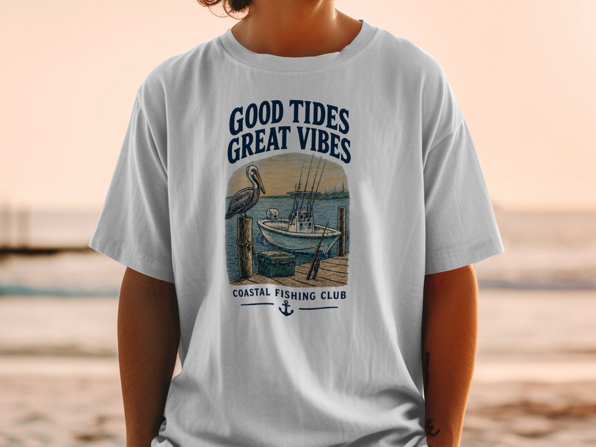 T-shirt with "Good Tides Great Vibes Coastal Fishing Club" graphic and nautical scene.