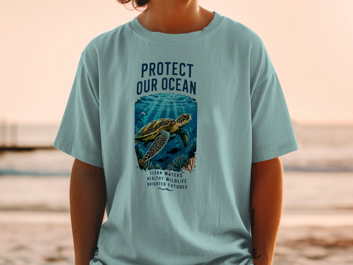 "Protect Our Ocean" graphic tee with sea turtle and coral reef illustration.