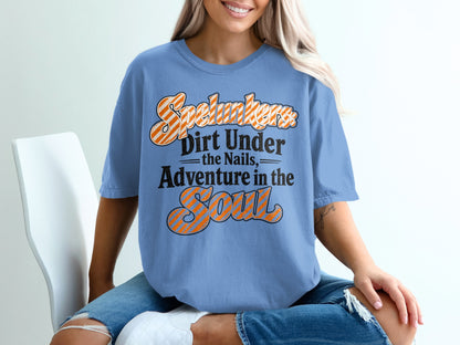 Blue t-shirt with text "Spelunkers Dirt Under the Nails Adventure in the Soul".