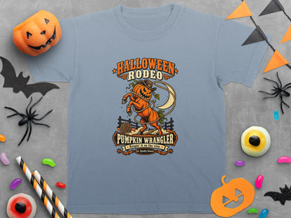 Light blue t-shirt with Halloween Rodeo Pumpkin Wrangler graphic featuring a bucking pumpkin.