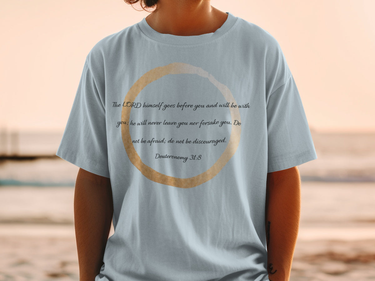 Light blue t-shirt with Deuteronomy 31:8 scripture inside a watercolor circle.