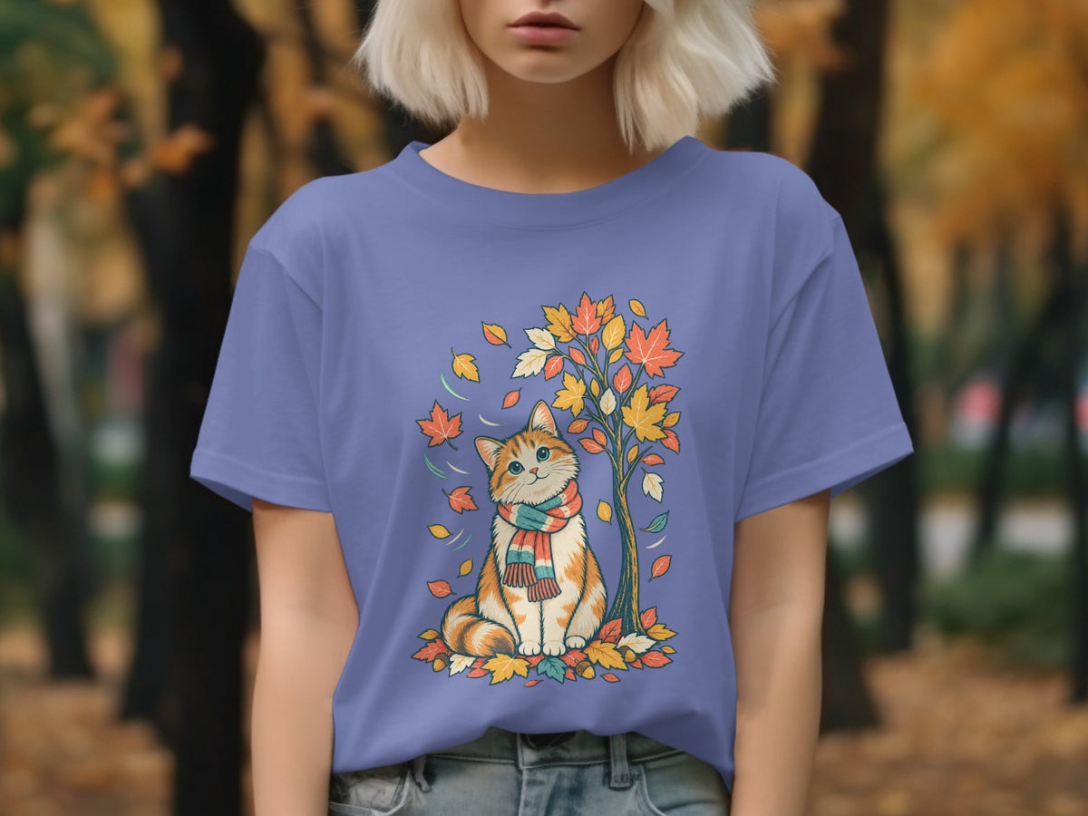 Illustration of a cat with a scarf sitting under a colorful autumn tree.