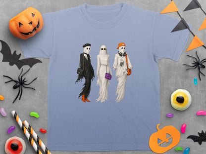 Three ghosts in fashionable attire are depicted on a light blue t-shirt.