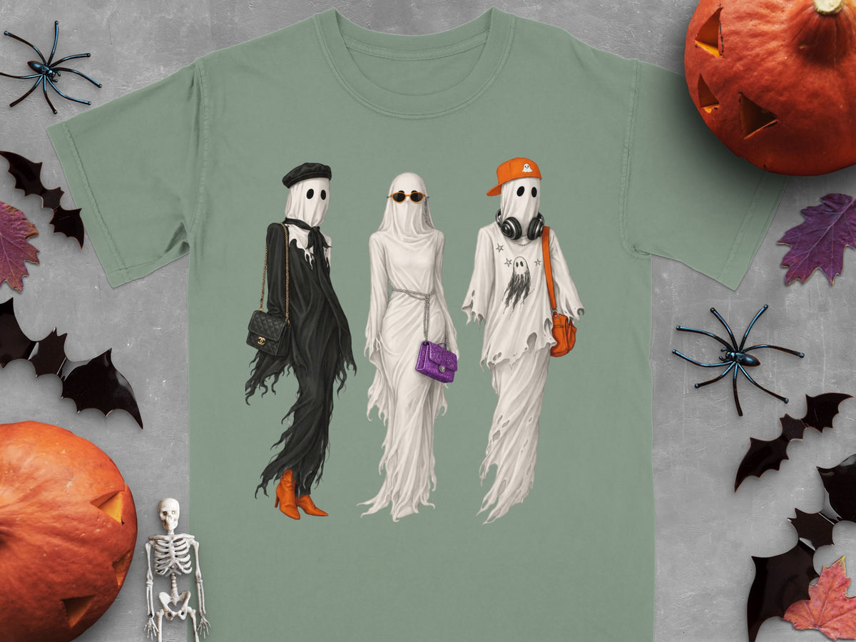 Three stylized ghosts in Halloween costumes stand together, one in black, two in white.