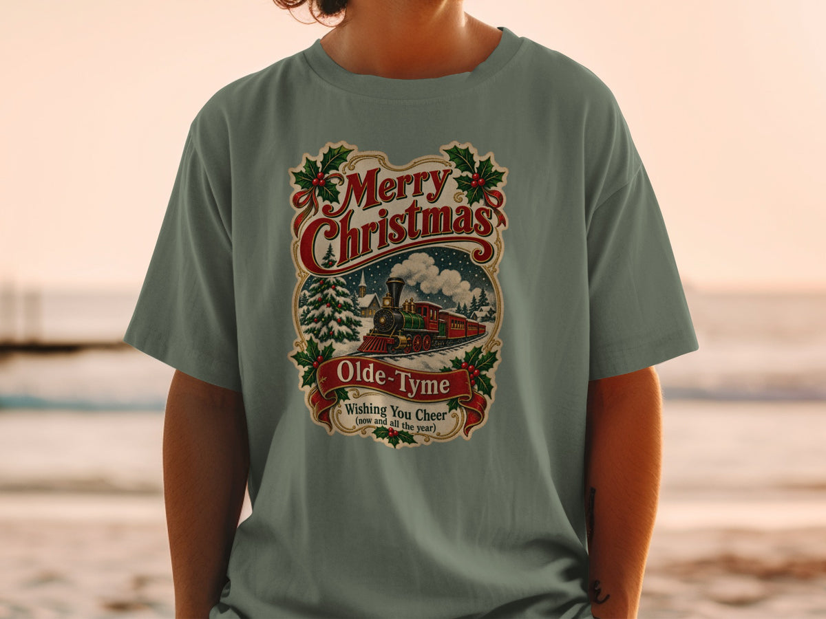 Green t-shirt with "Merry Christmas Olde-Tyme Wishing You Cheer" design featuring a train.