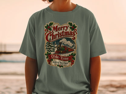 Green t-shirt with "Merry Christmas Olde-Tyme Wishing You Cheer" design featuring a train.