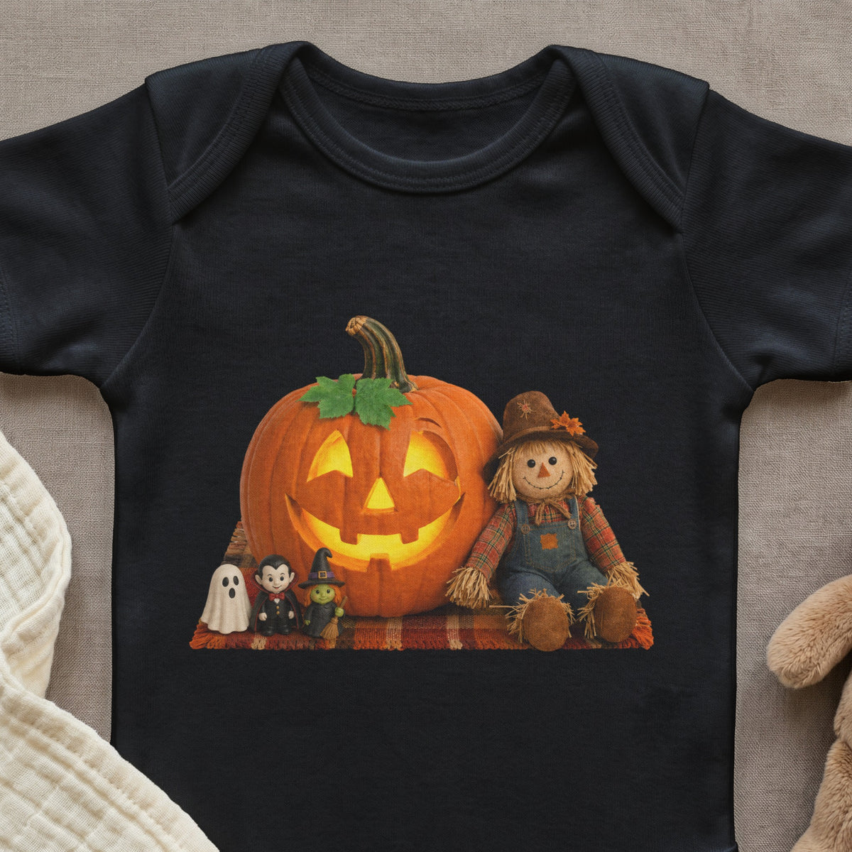 Black bodysuit with Halloween print of a smiling pumpkin, scarecrow, ghost, vampire, and witch.