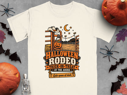 T-shirt with Halloween Rodeo graphic featuring a pumpkin bucket and cowboy hat.