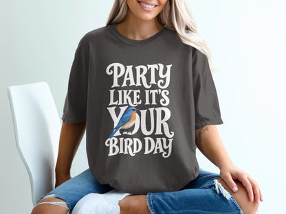 Dark grey t-shirt with white text "PARTY LIKE IT'S YOUR BIRD DAY" and a blue bird graphic.