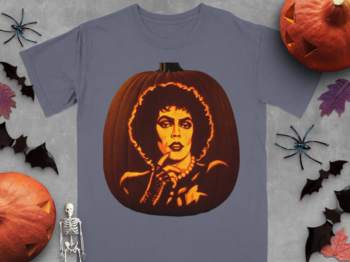 A gray t-shirt featuring a glowing carved pumpkin portrait of Frank-N-Furter surrounded by Halloween decorations.