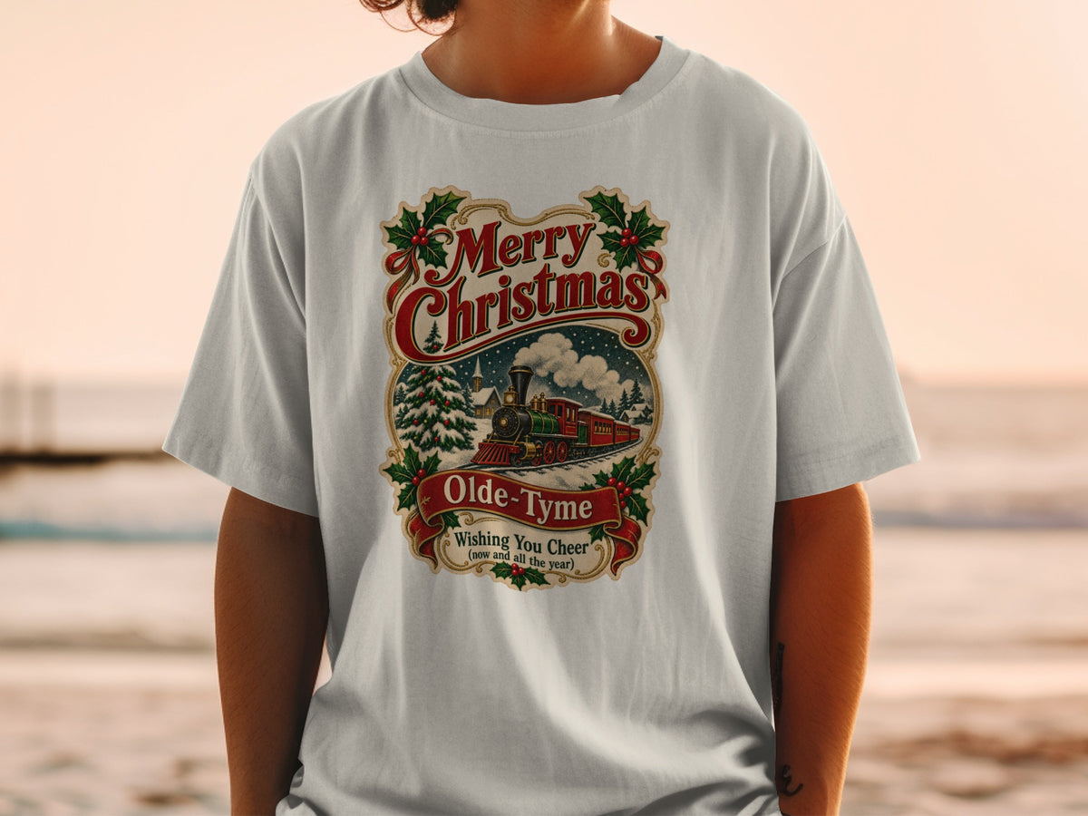 T-shirt with vintage Merry Christmas train design and holly accents.