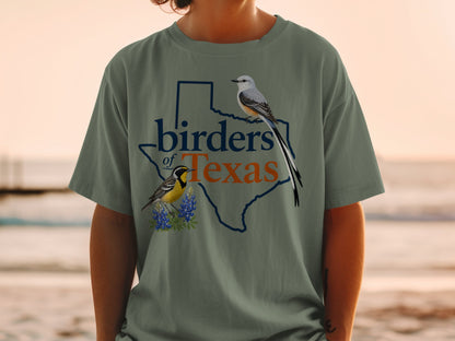 Green t-shirt with Texas outline, two birds, and text "birders of Texas."