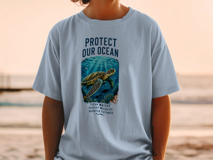 T-shirt with "Protect Our Ocean" text and a sea turtle underwater.