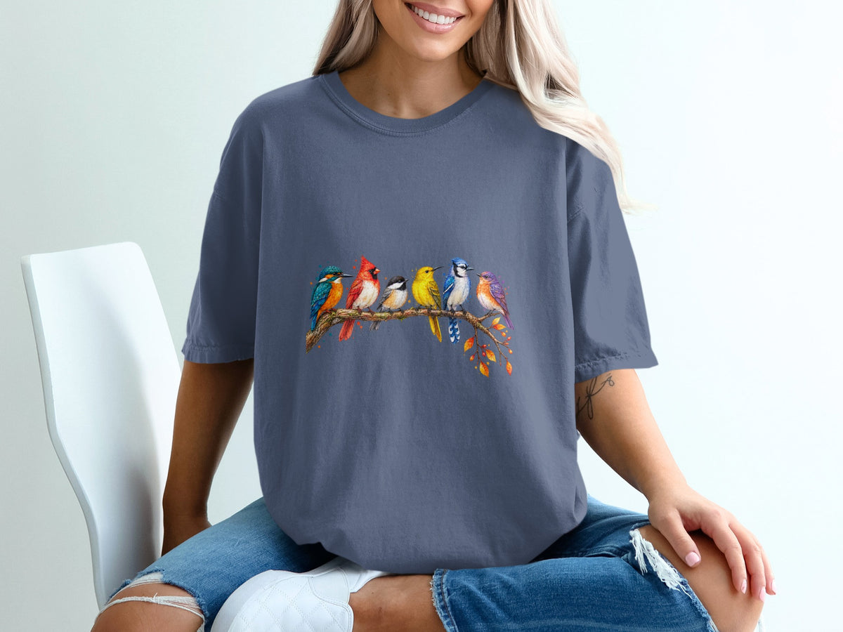 A group of colorful birds sits on a branch with autumn leaves.