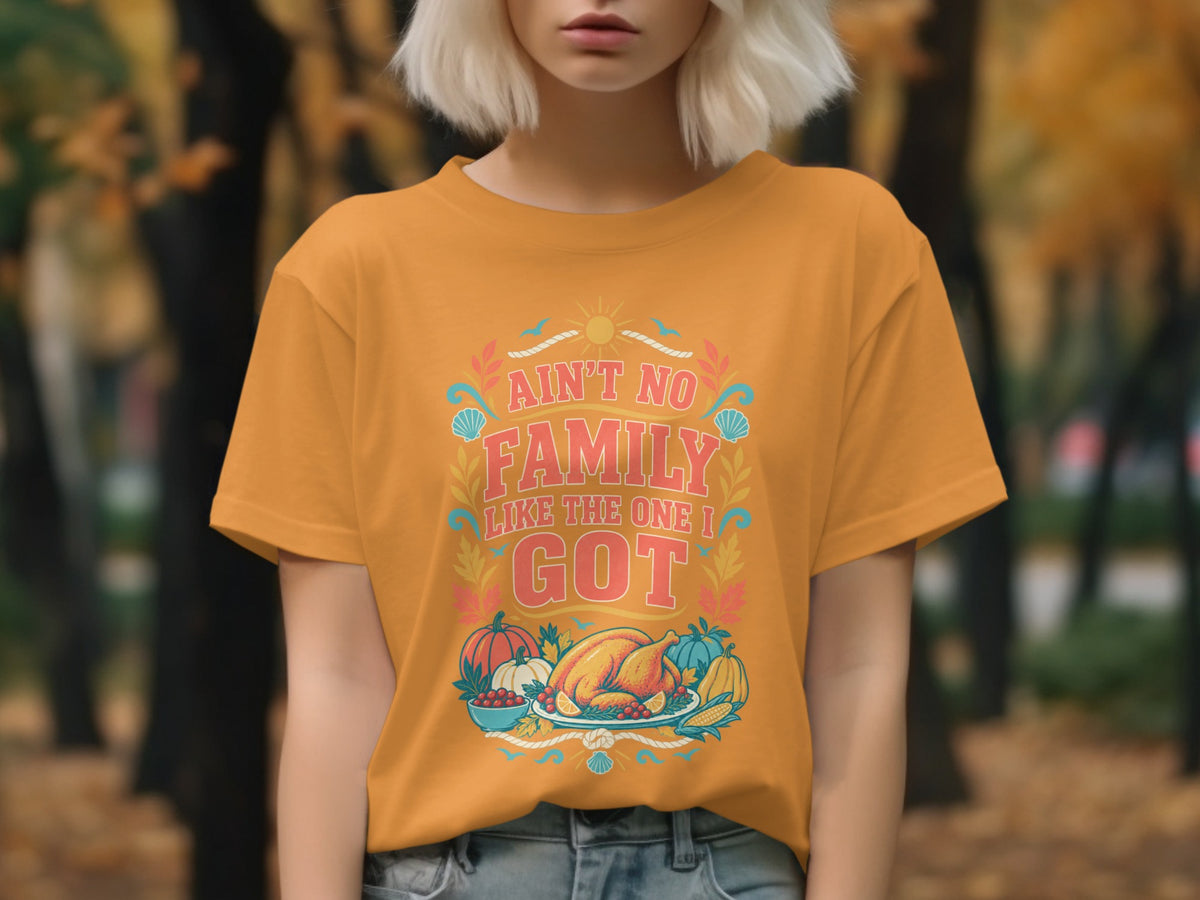 Orange t-shirt with "Ain't No Family Like The One I Got" and Thanksgiving food graphic.