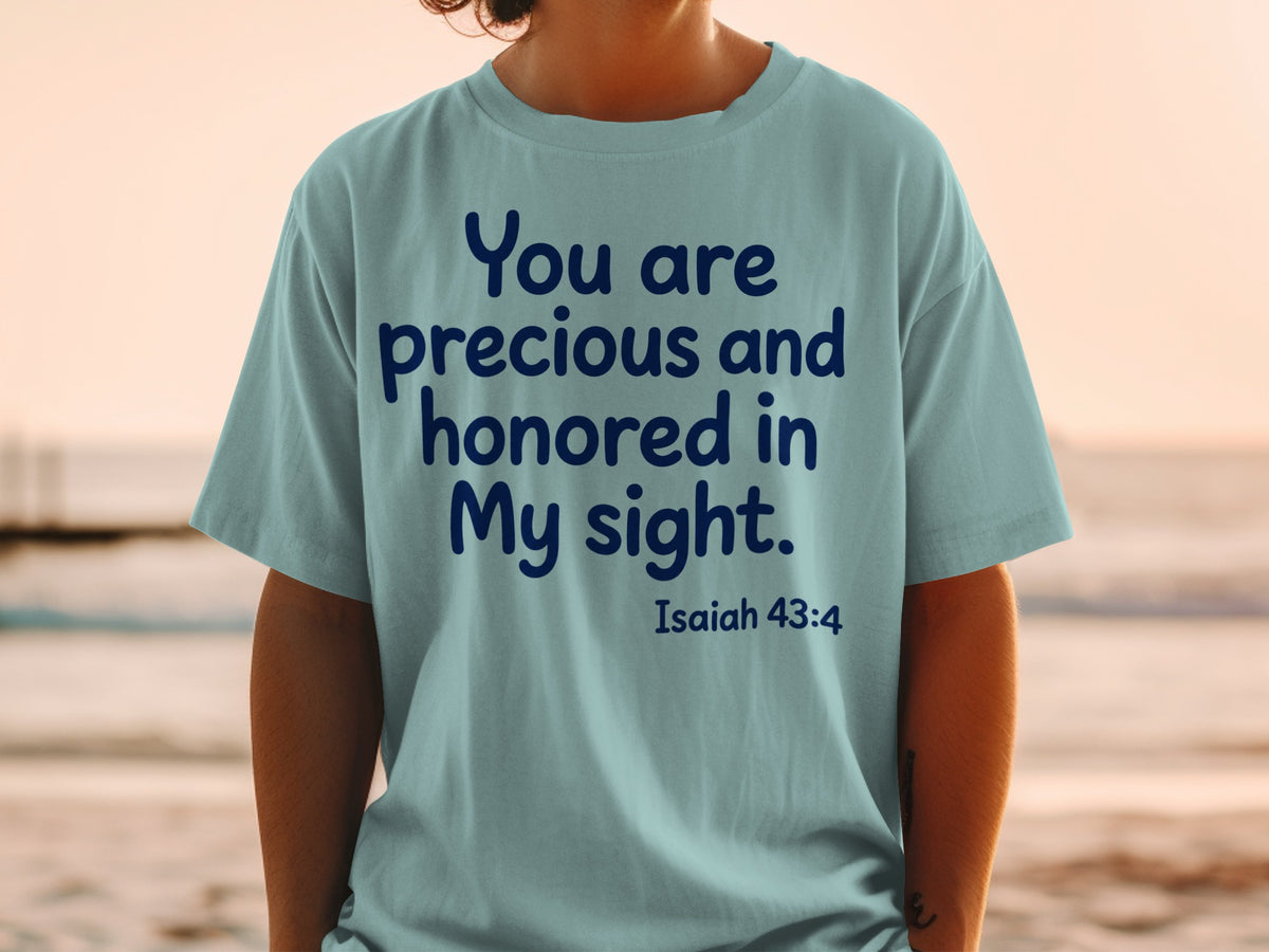 Light blue t-shirt with dark blue text: "You are precious and honored in My sight. Isaiah 43:4"