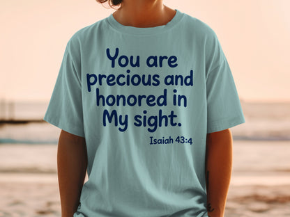 Light blue t-shirt with dark blue text: "You are precious and honored in My sight. Isaiah 43:4"