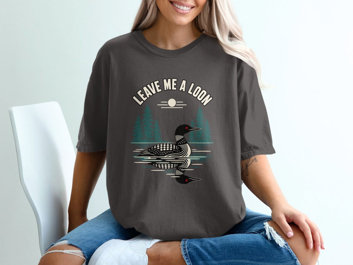 T-shirt with "Leave Me a Loon" text and loon reflection graphic.
