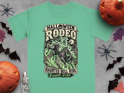Green t-shirt with "Halloween Rodeo Haunted Bull Ride" graphic and a skeleton cowboy.