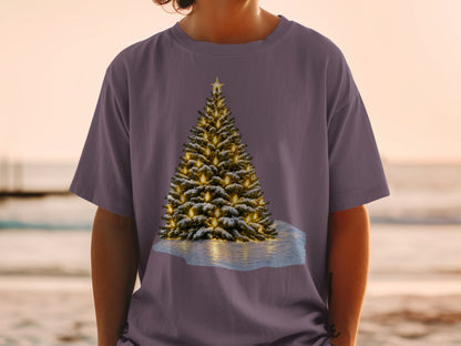 Christmas tree with lights and snow graphic on a purple t-shirt.