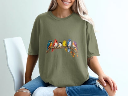 Green t-shirt with colorful painted birds perched on a branch graphic.