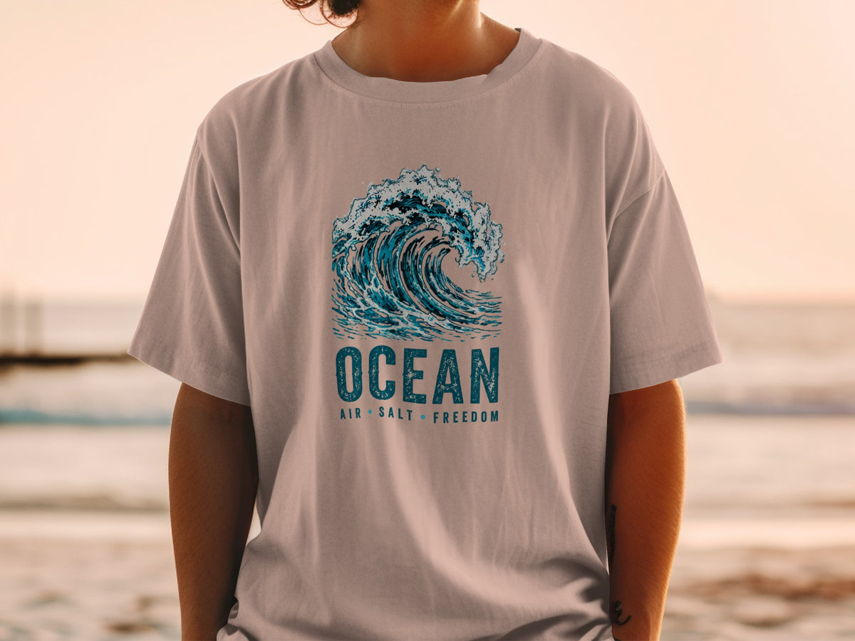 T-shirt with crashing wave graphic and text "OCEAN AIR SALT FREEDOM".