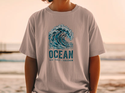T-shirt with crashing wave graphic and text "OCEAN AIR SALT FREEDOM".