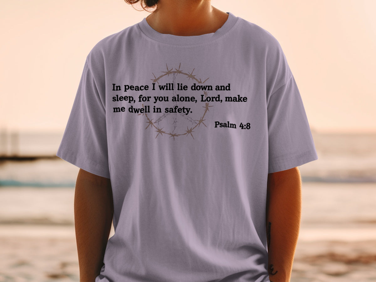 Purple t-shirt with Psalm 4:8 quote and barbed wire peace symbol.